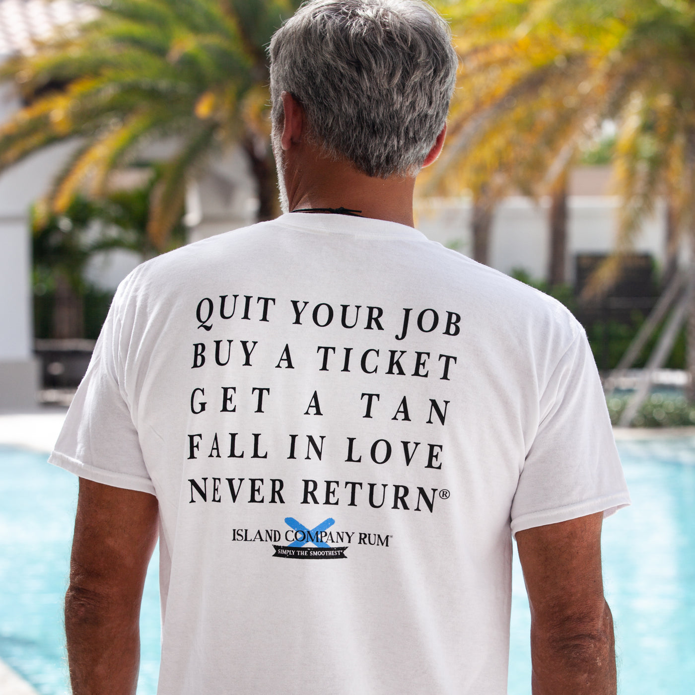 Quit Your Job, Buy A Ticket, Get A Tan, Fall In Love, Never Return® - Island Company Rum - Unisex Tee Shirt- White | Best tasting rum | Buy rum online | islandcompanyrum.com